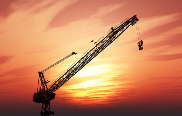 3D render of a crane against a sunset sky